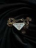Prada Triangle Pendant Necklace.
