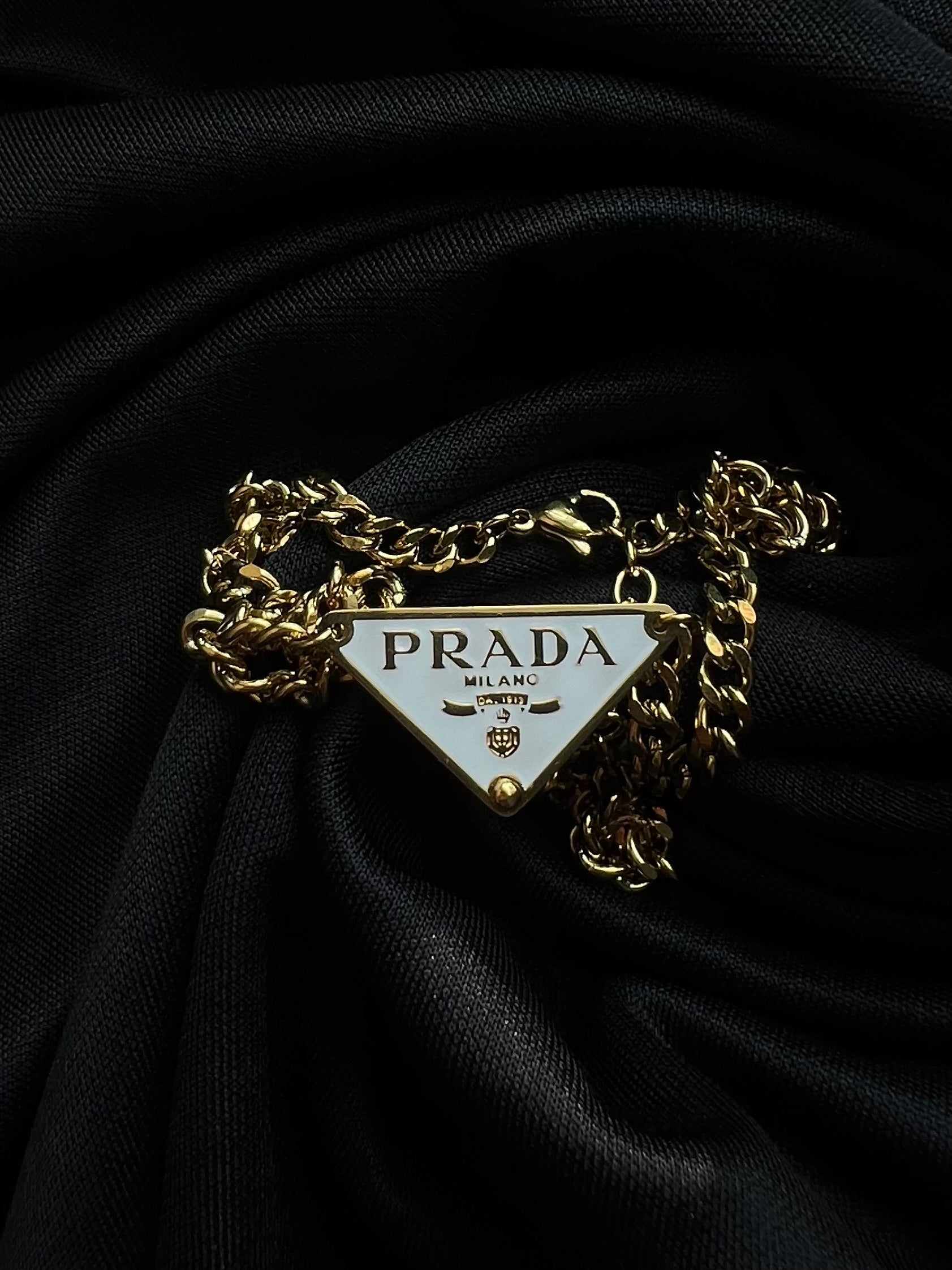 Prada Triangle Pendant Necklace.