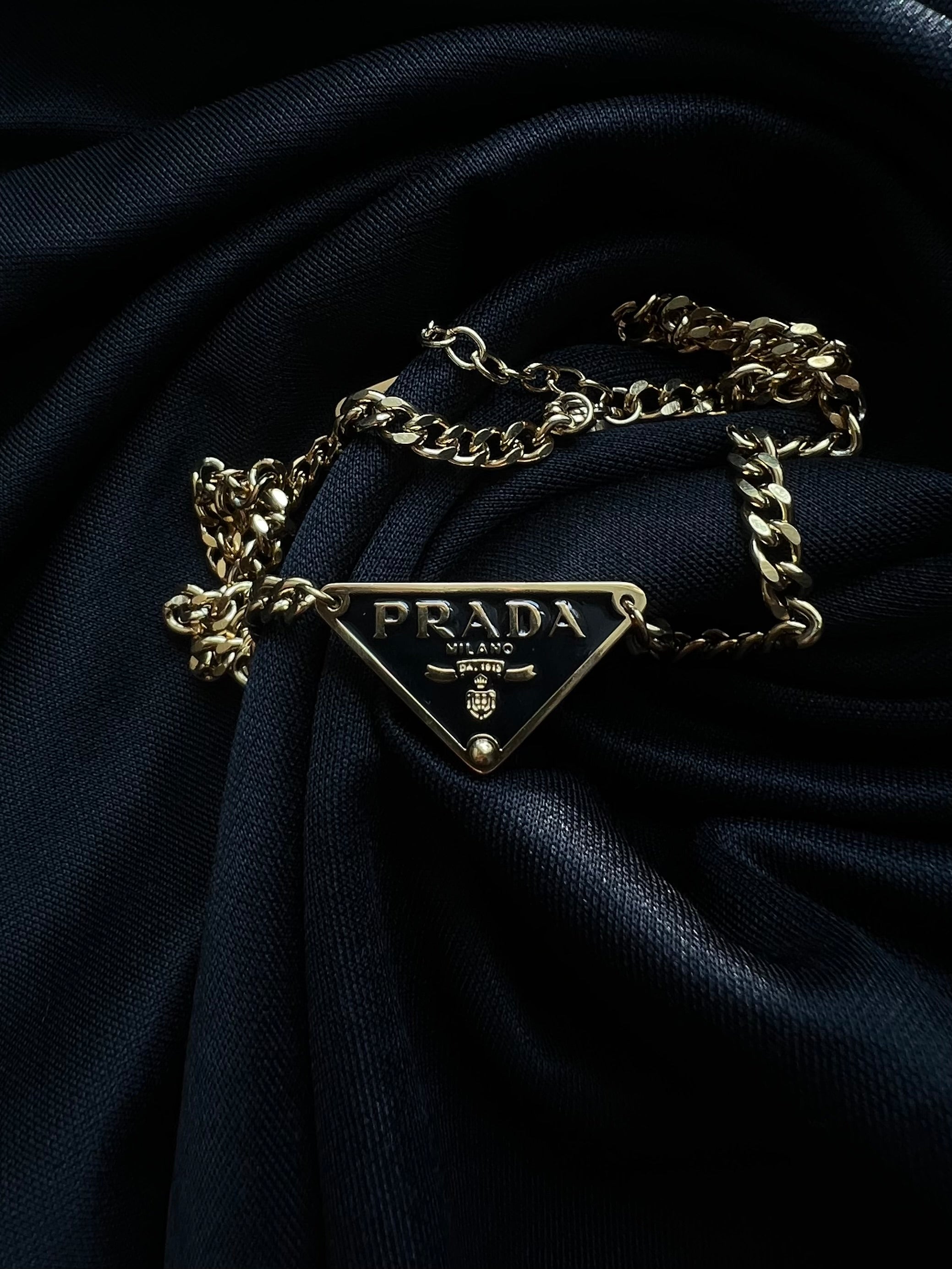 Prada Triangle Pendant Necklace.